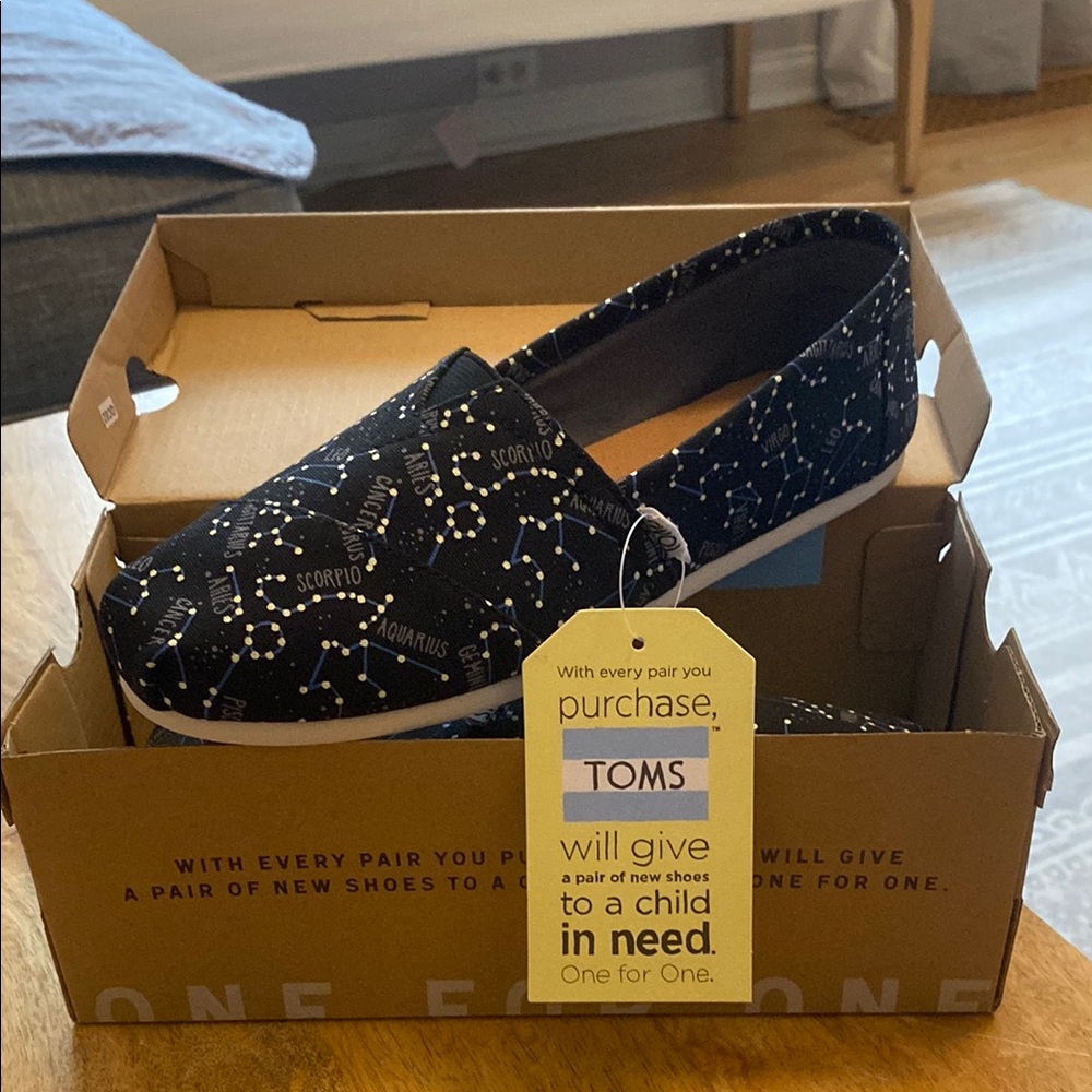 TOMS Black Constellation Slip-Ons